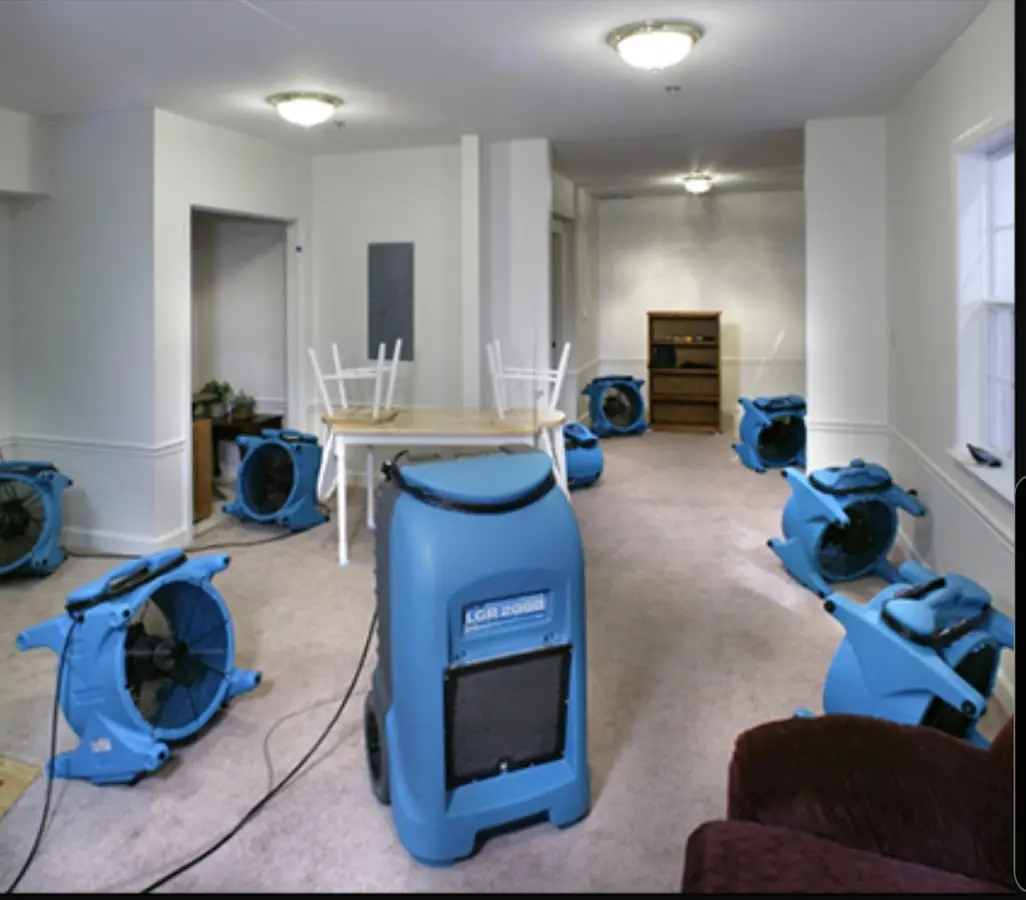 Air movers and dehumidifier setup for Water Damage Restoration in Millbrook